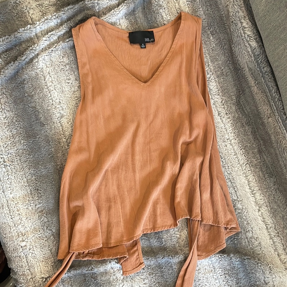 Cognac colored open back tank with bow detail. Never worn. Size small.